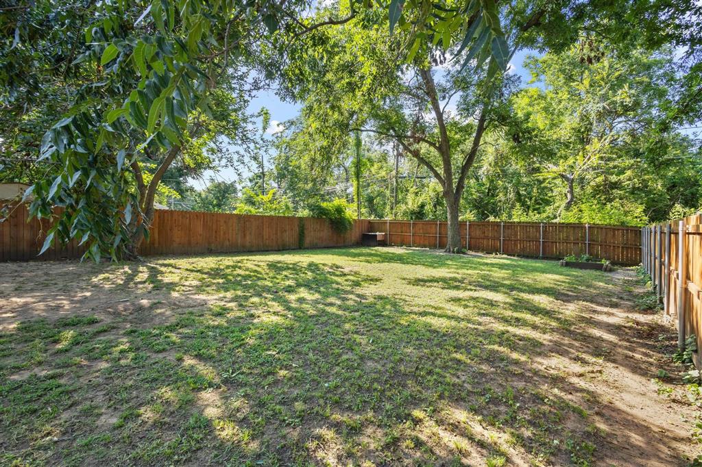610 West Elm Street Denison, TX 75020 - Photo 25 of 26 a view of a yard with a tree