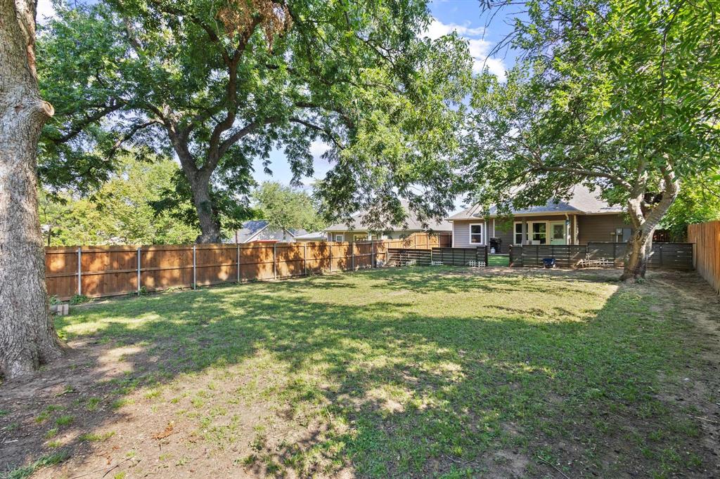 610 West Elm Street Denison, TX 75020 - Photo 26 of 26 a view of house with backyard space and garden