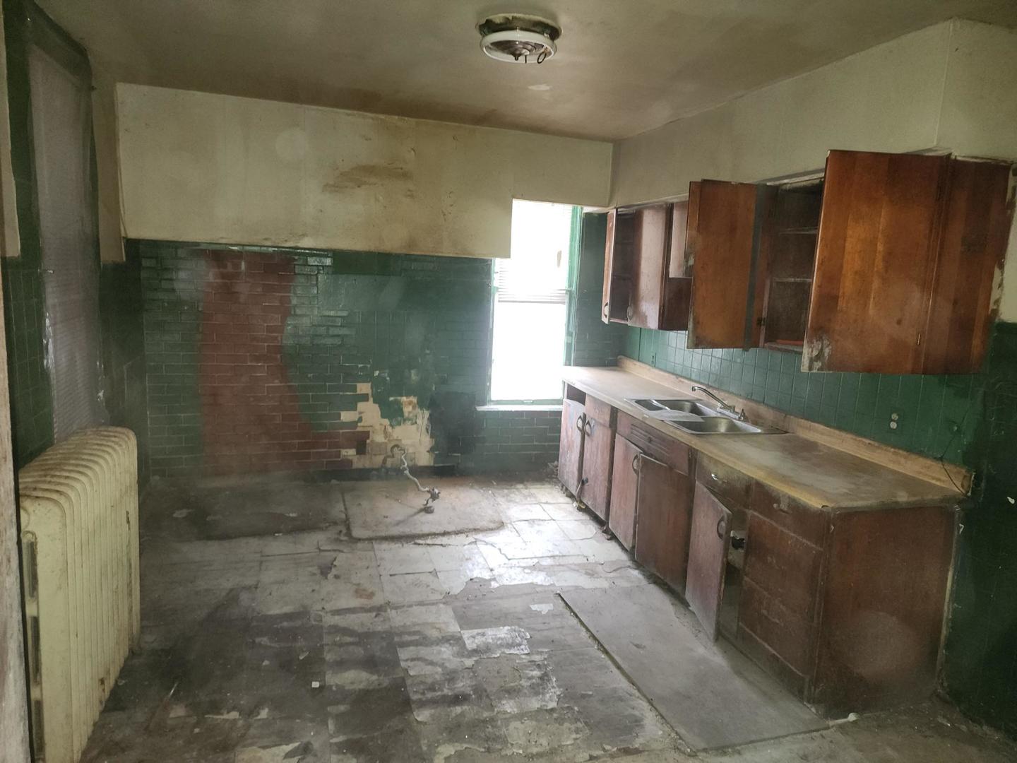 5633 South Sangamon Street Chicago, IL 60621 - Photo 5 of 11 a bathroom with a granite countertop sink a toilet and shower