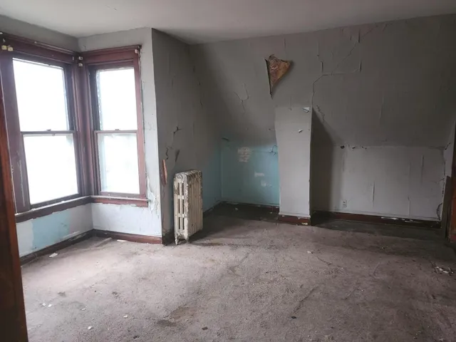 an empty room with windows