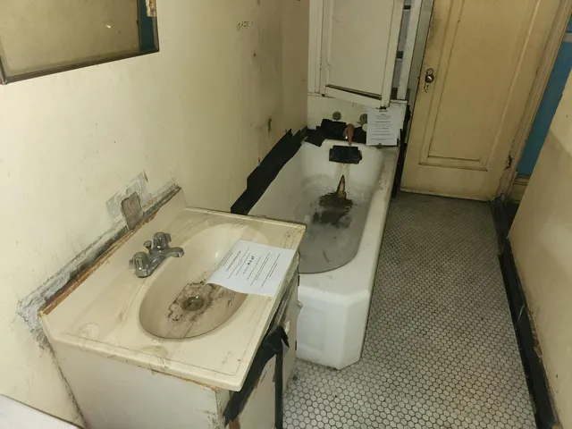 a bathroom with a sink and mirror