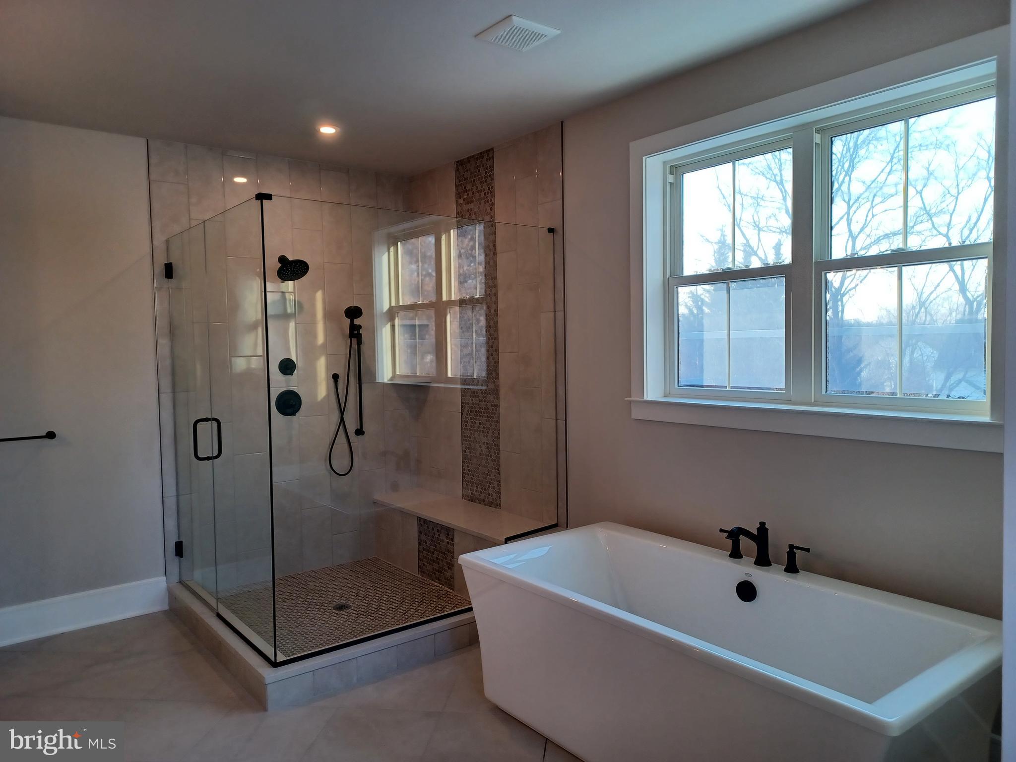 825 C Morris Road Lansdale, PA 19446 - Photo 7 of 8 a bathroom with a tub a sink and shower