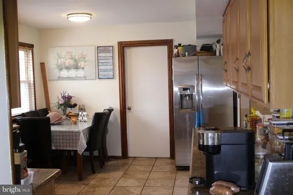 a bathroom with a toilet sink and shower curtain