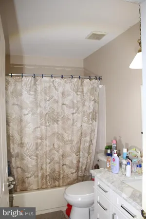 a bathroom with a mirror and a sink