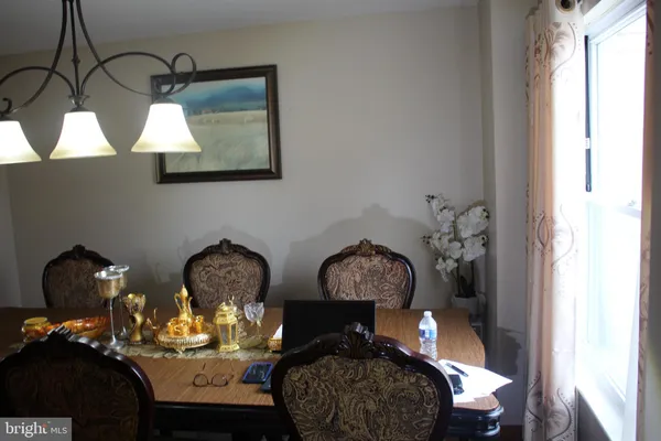 a view of a lake with a table and chairs