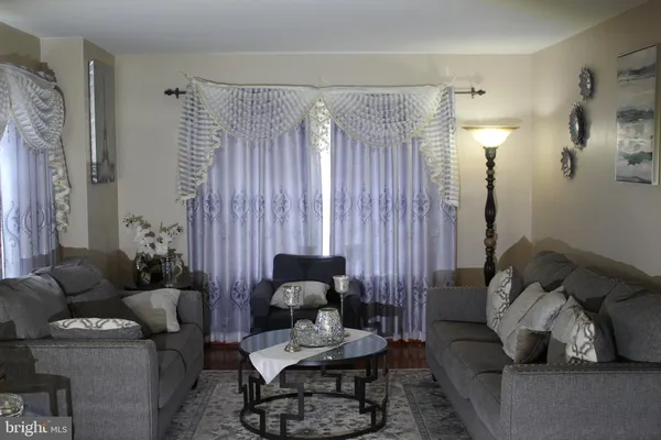 a kitchen with stainless steel appliances a stove a microwave a sink and cabinets