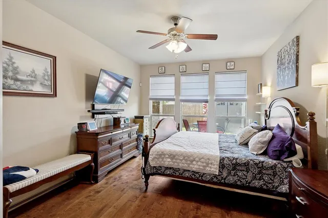 a bedroom with a bed couch and window