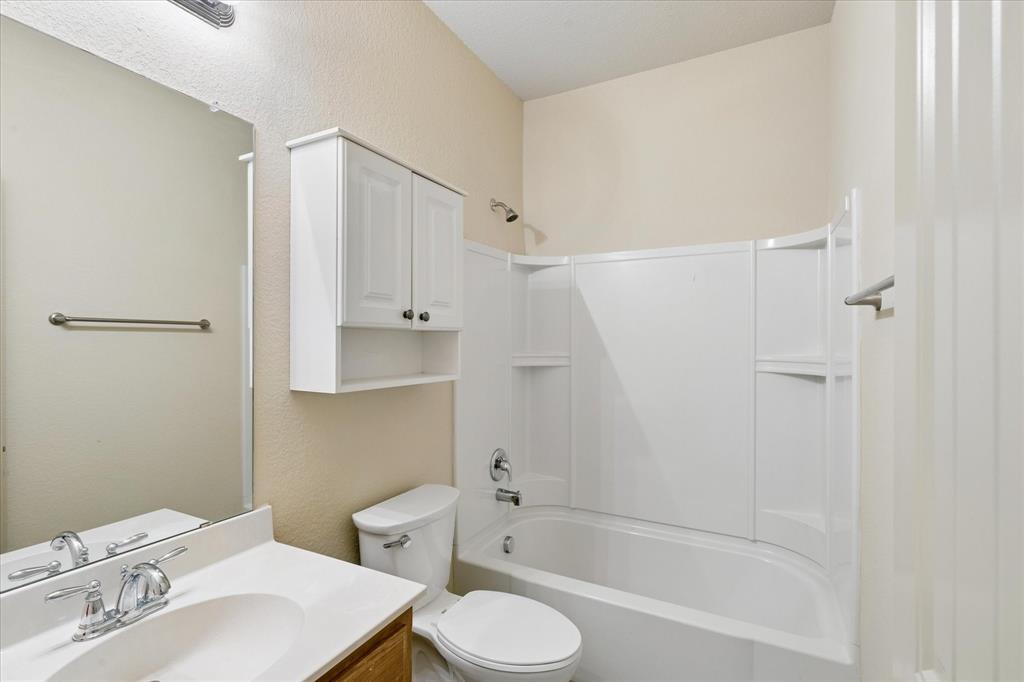 10205 Point Lobos Trail Fort Worth, TX 76177 - Photo 18 of 29 a bathroom with a sink toilet and shower