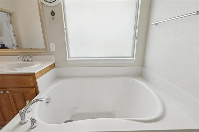 a white bath tub sitting in a bathroom
