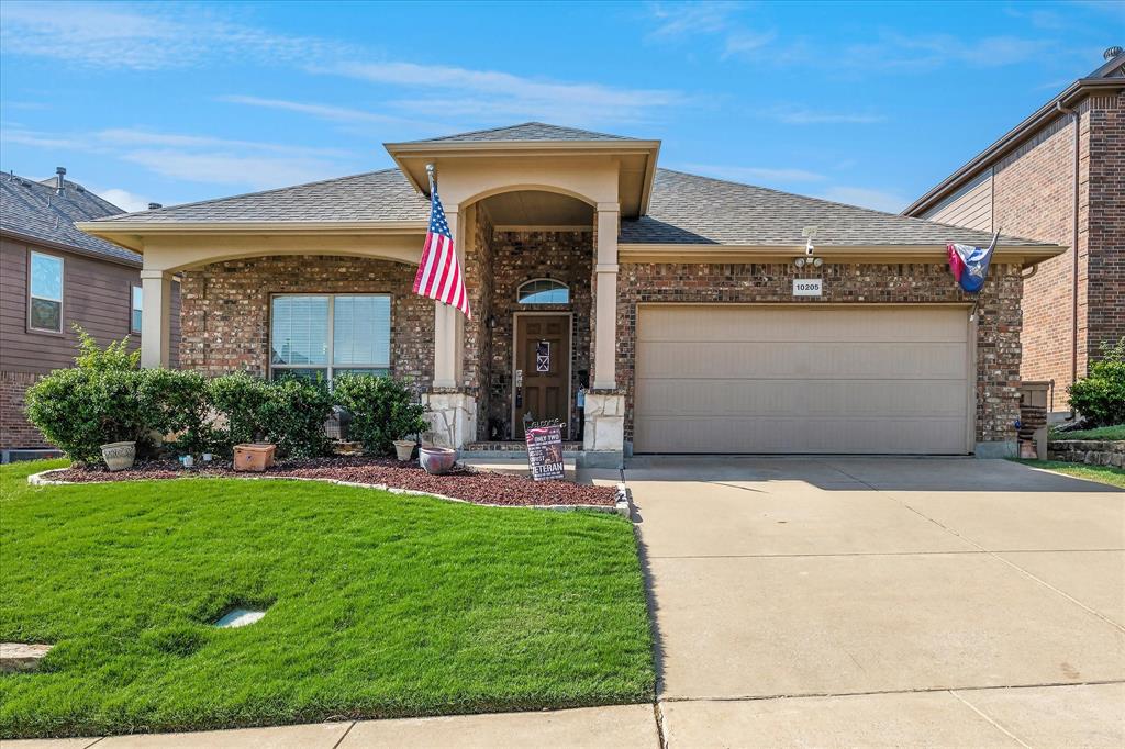 10205 Point Lobos Trail Fort Worth, TX 76177 - Photo 2 of 29 a front view of a house with a yard