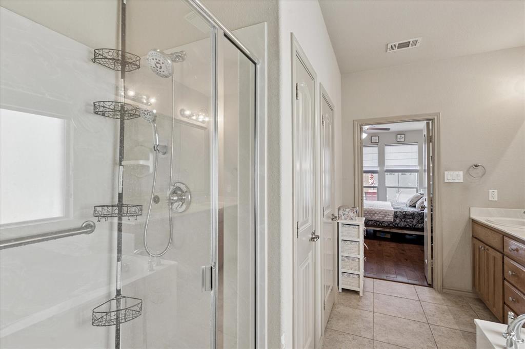 10205 Point Lobos Trail Fort Worth, TX 76177 - Photo 21 of 29 a en suite bathroom with a shower and a sink