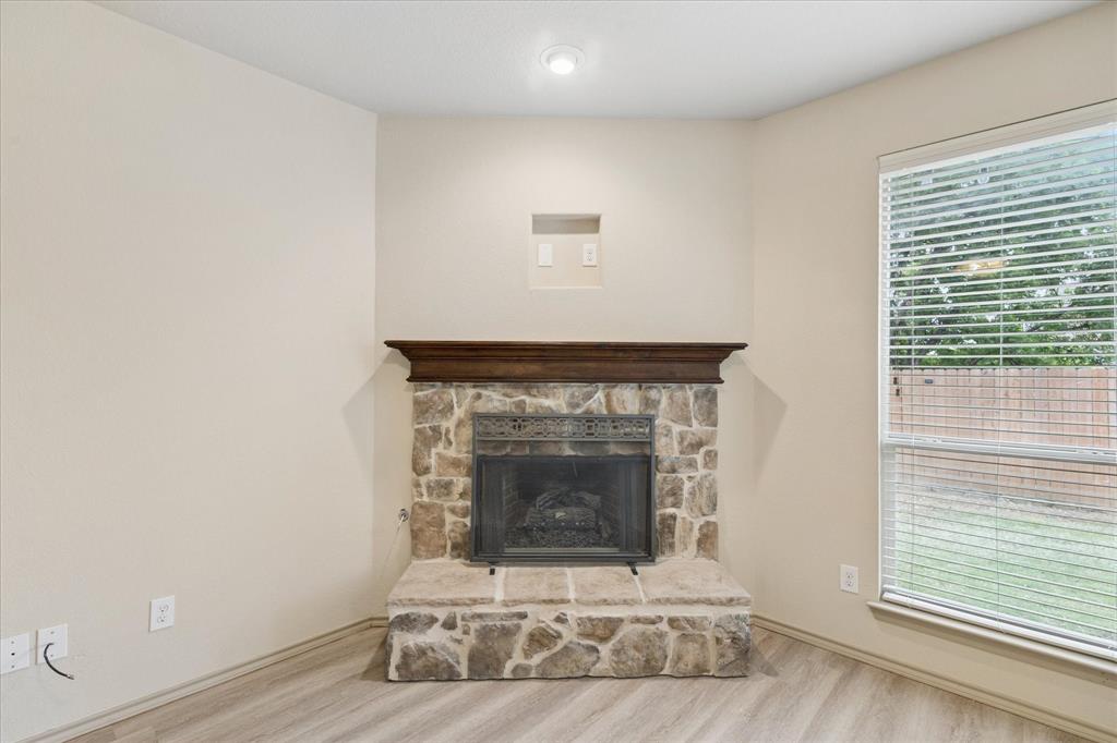 10205 Point Lobos Trail Fort Worth, TX 76177 - Photo 7 of 29 a white building with a fireplace