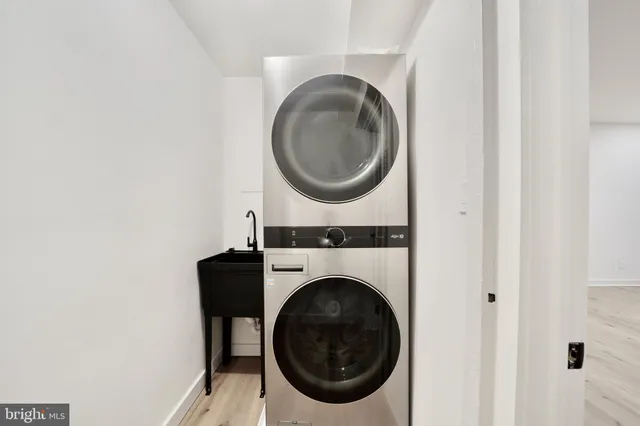 a view of entryway with stairs and white door