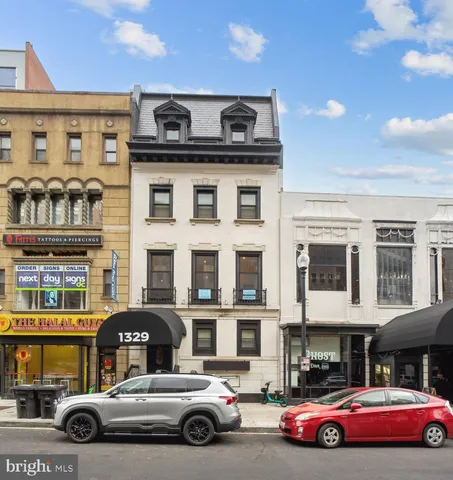 a front view of a building with parking space