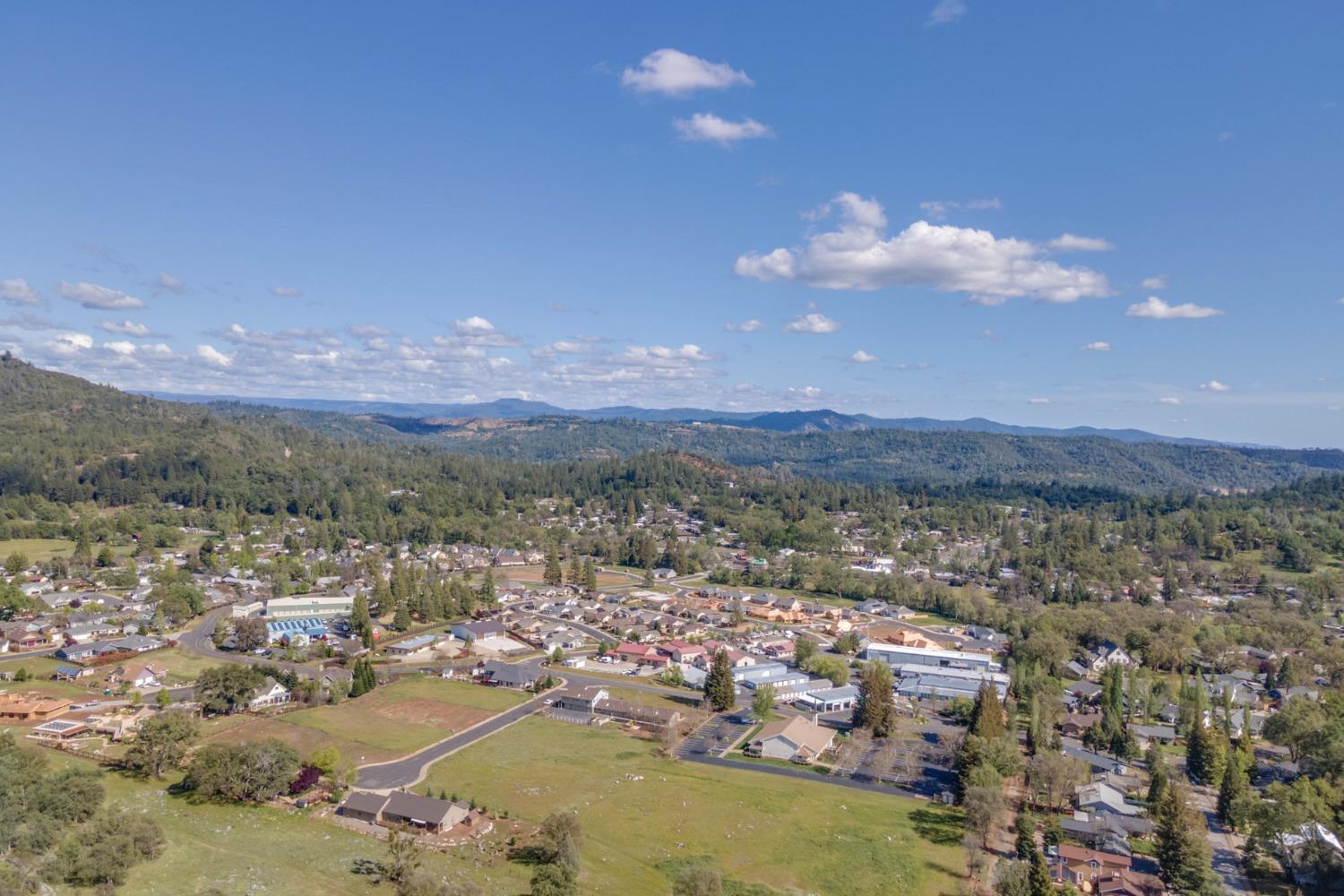 566 Friendly Court Murphys, CA 95247 - Photo 9 of 9 a view of a city with lots of residential buildings ocean and mountain in the back