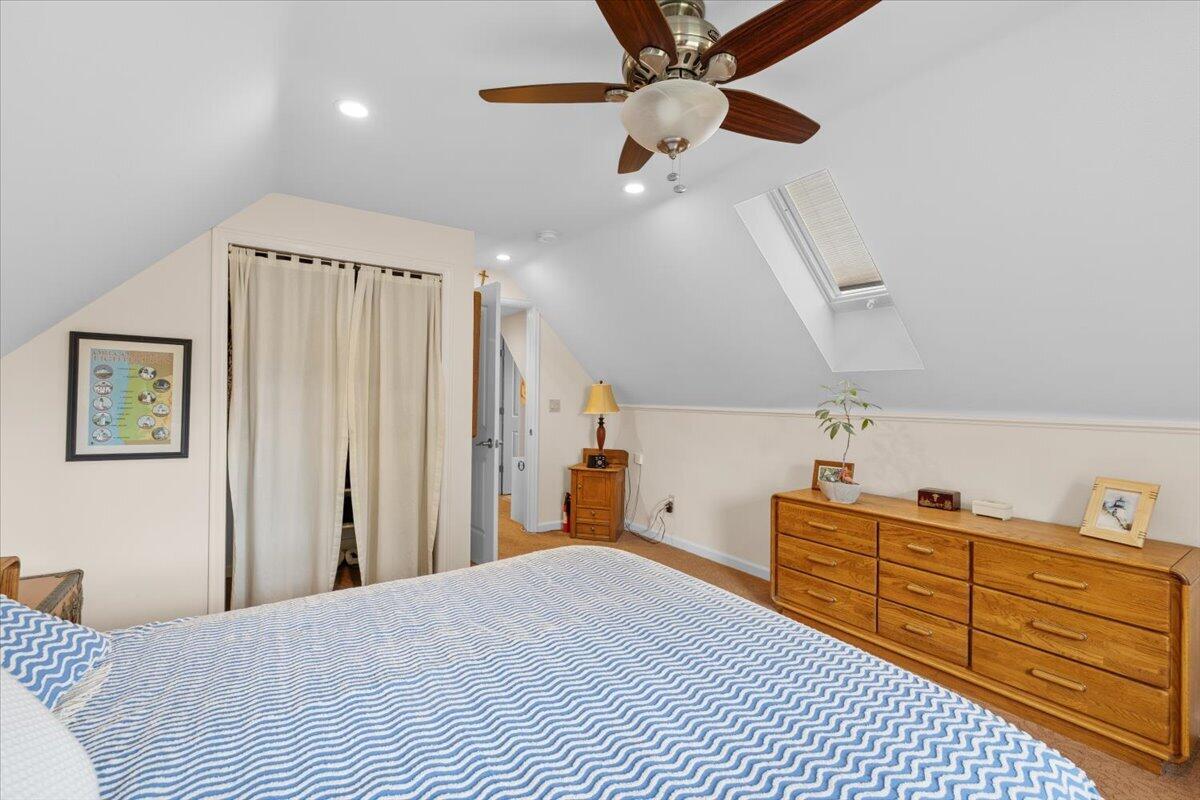 440 Bush Street Central Point, OR 97502 - Photo 26 of 40 a bedroom with a bed and a chandelier