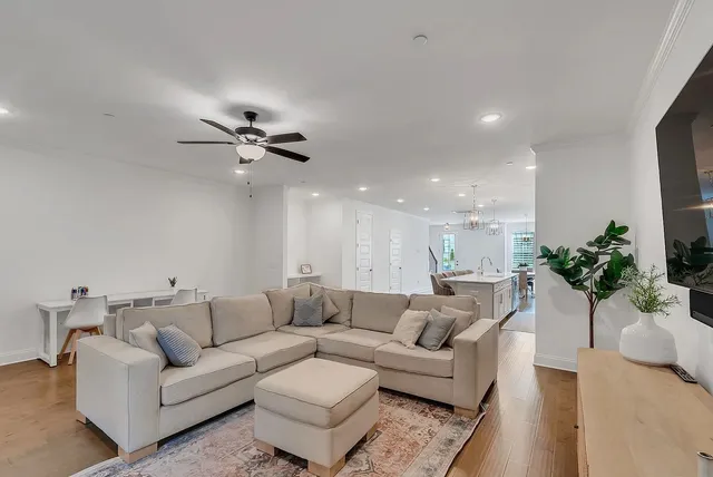 a view of a livingroom with furniture and a potted plant