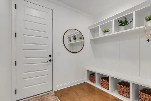 a view of an empty room with kitchen