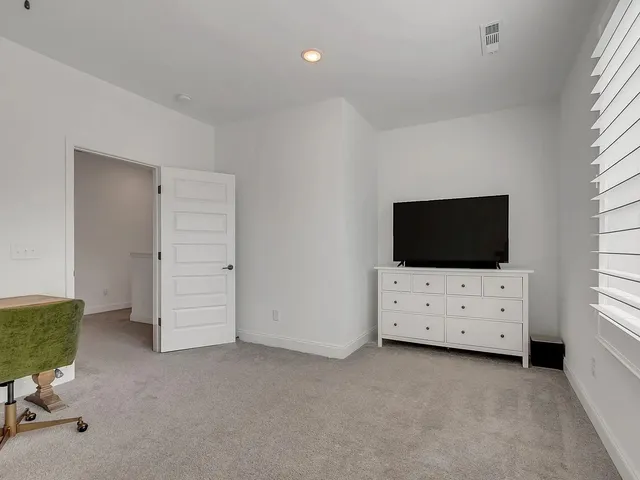 a view of workspace with flat screen tv