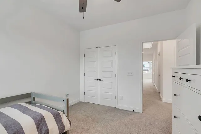 a bedroom with a bed and a cabinets