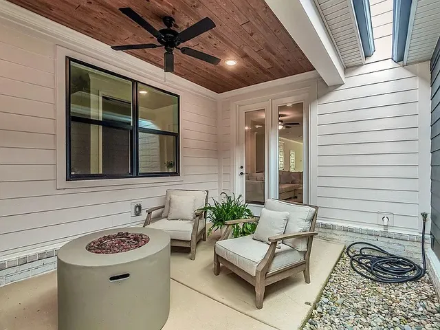 a bathroom with a sink a window and couch
