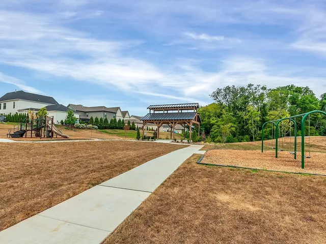 a view of a swimming pool with a yard