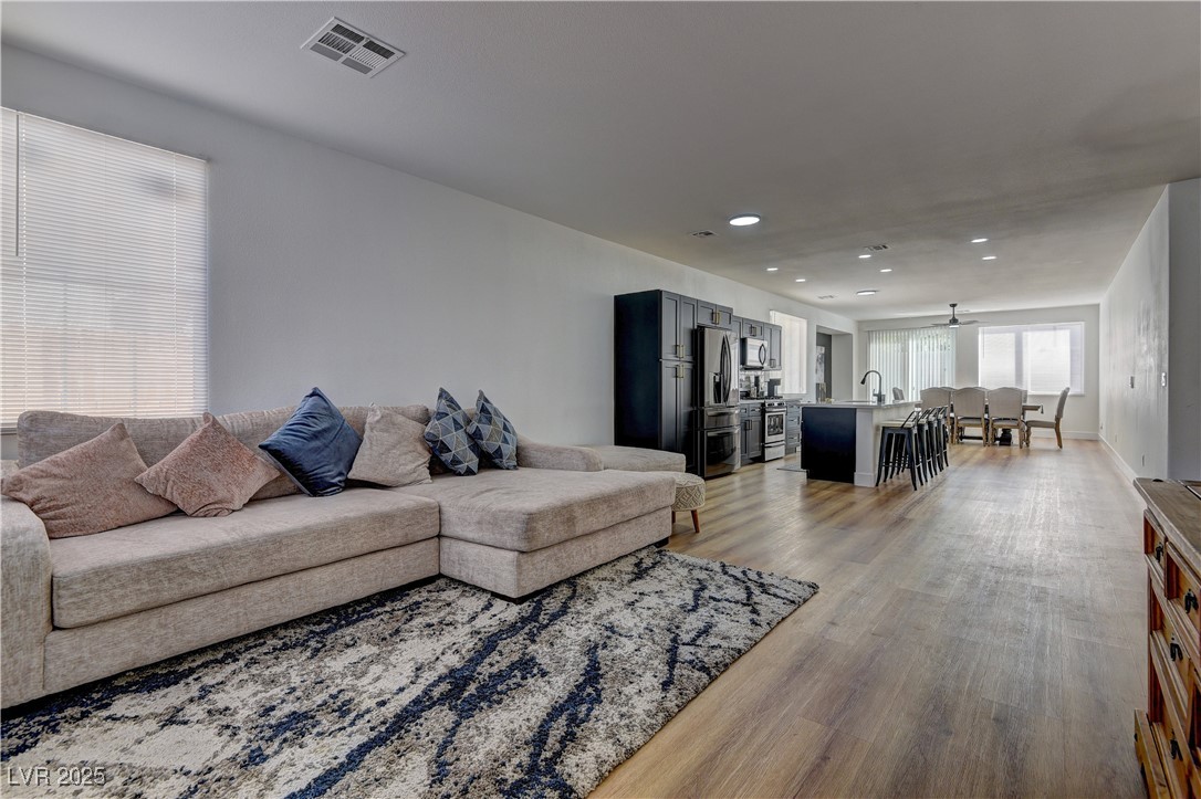 1176 Colgate Lane Las Vegas, NV 89110 - Photo 4 of 15 Living area with light wood-style flooring and recessed lighting