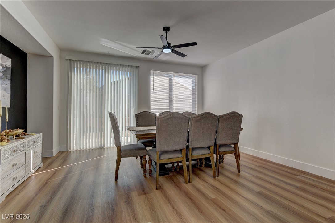 1176 Colgate Lane Las Vegas, NV 89110 - Photo 9 of 15 Dining area featuring wood finished floors and a ceiling fan