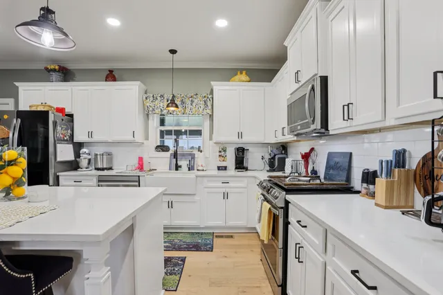 a view of walk in closet with clothes
