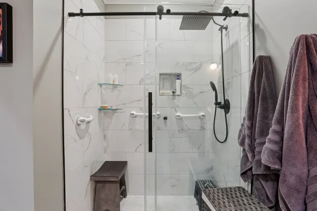 a view of a garage with a white house