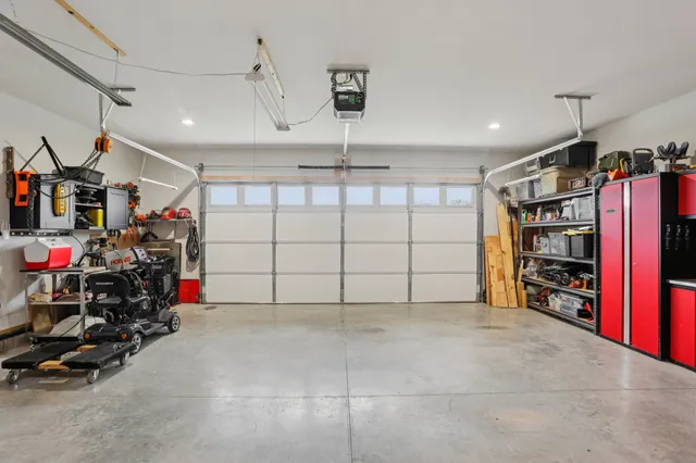 a front view of a house with a garden and yard