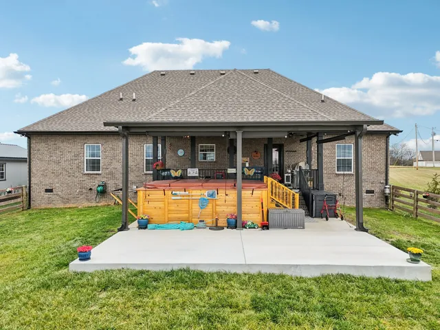 an aerial view of a residential houses with outdoor space