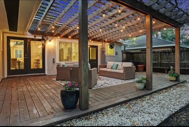 a view of living room with furniture and floor to ceiling window