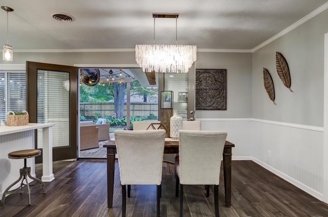 6022 Woodbrook Lane Houston, TX 77008 - Photo 5 of 20 a view of a dining room with furniture wooden floor and chandelier
