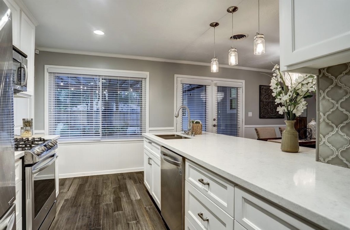 6022 Woodbrook Lane Houston, TX 77008 - Photo 7 of 20 a kitchen with a sink appliances and cabinets