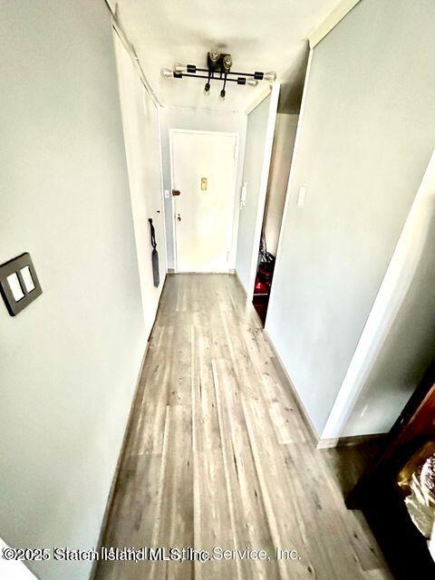 1000 Clove Road, Unit 3G Staten Island, NY 10301 - Photo 12 of 25 a view of a hallway with wooden floor