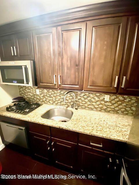 1000 Clove Road, Unit 3G Staten Island, NY 10301 - Photo 6 of 25 a view of a sink and dishwasher