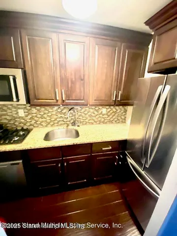 view of a room with wooden floor