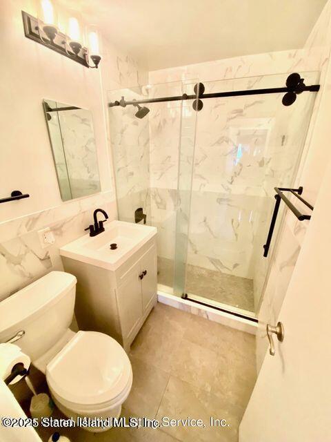 1000 Clove Road, Unit 3G Staten Island, NY 10301 - Photo 10 of 25 a bathroom with a sink toilet and shower
