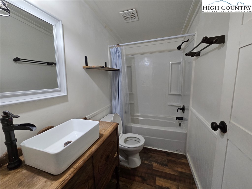 618 Rhymer Branch Road Deep Gap, NC 28618 - Photo 15 of 24 a bathroom with a sink toilet and shower