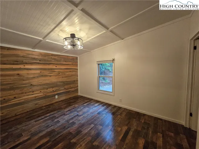 a view of room with window and ceiling fan