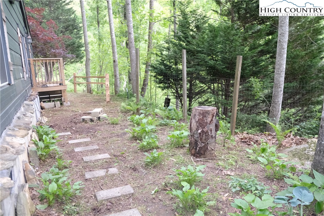 618 Rhymer Branch Road Deep Gap, NC 28618 - Photo 2 of 24 a garden view with a seating space