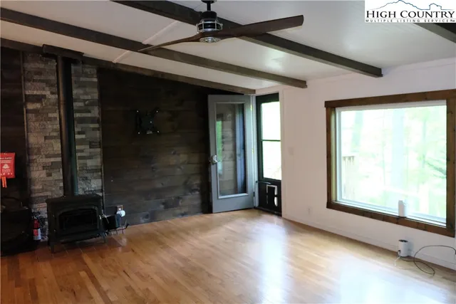 closeup of a livingroom with furniture and a fireplace