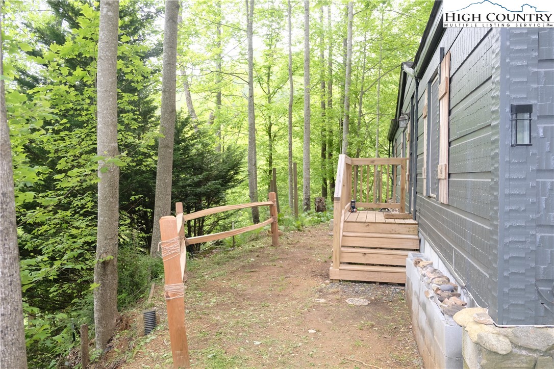618 Rhymer Branch Road Deep Gap, NC 28618 - Photo 6 of 24 a view of a garden with stairs