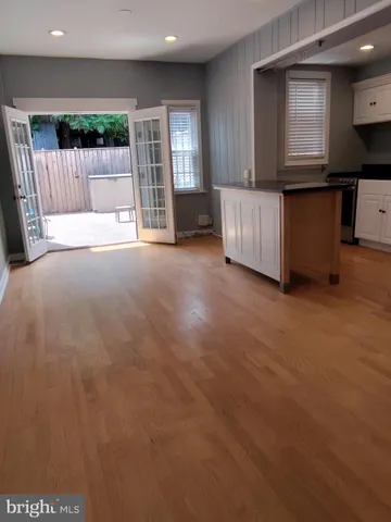 a view of kitchen with furniture and large window