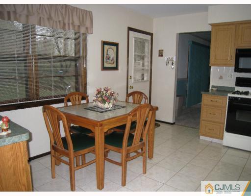12 Roxy Avenue Edison, NJ 08820 - Photo 3 of 8 a dining room with furniture and window