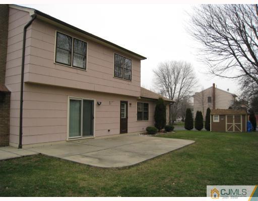 12 Roxy Avenue Edison, NJ 08820 - Photo 8 of 8 a front view of a house with a yard and trees