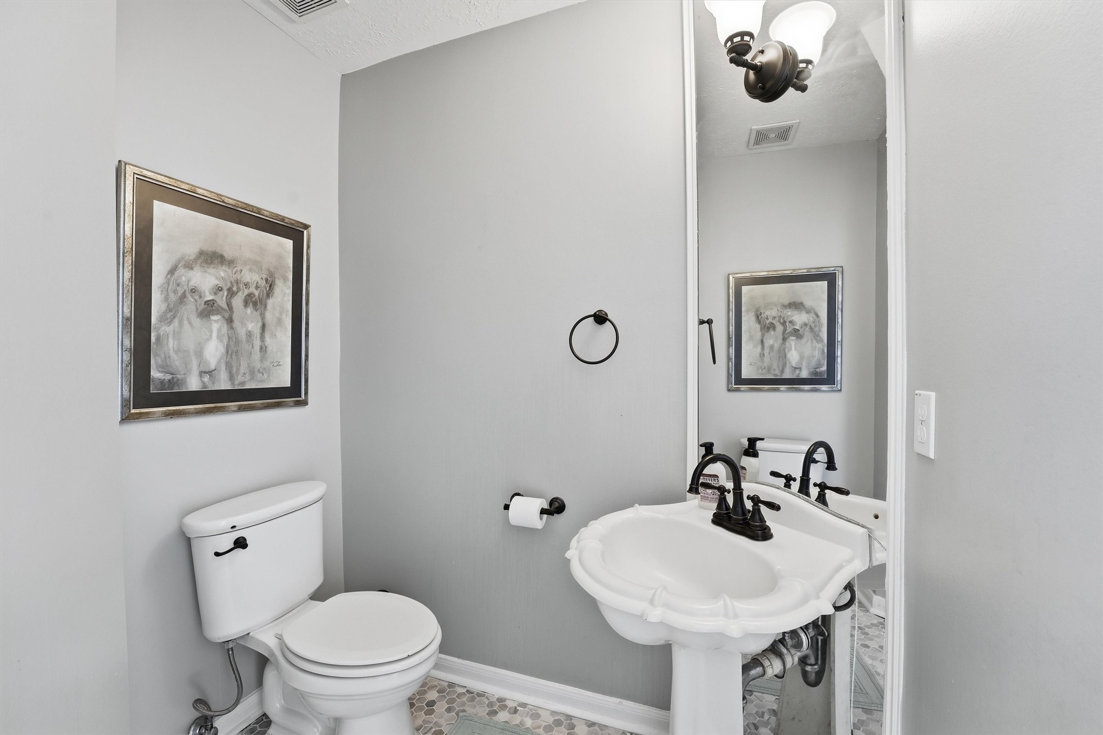 8827 Mile Run Road Humble, TX 77346 - Photo 8 of 37 a bathroom with a sink mirror and toilet