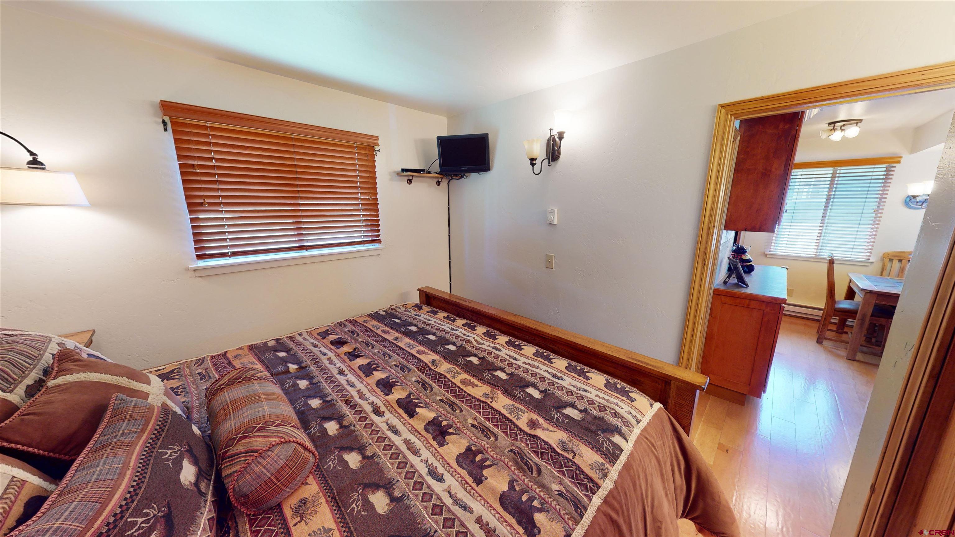 18 Crystal Road, Unit 3B Crested Butte, CO 81225 - Photo 15 of 20 a bedroom with a bed and a window