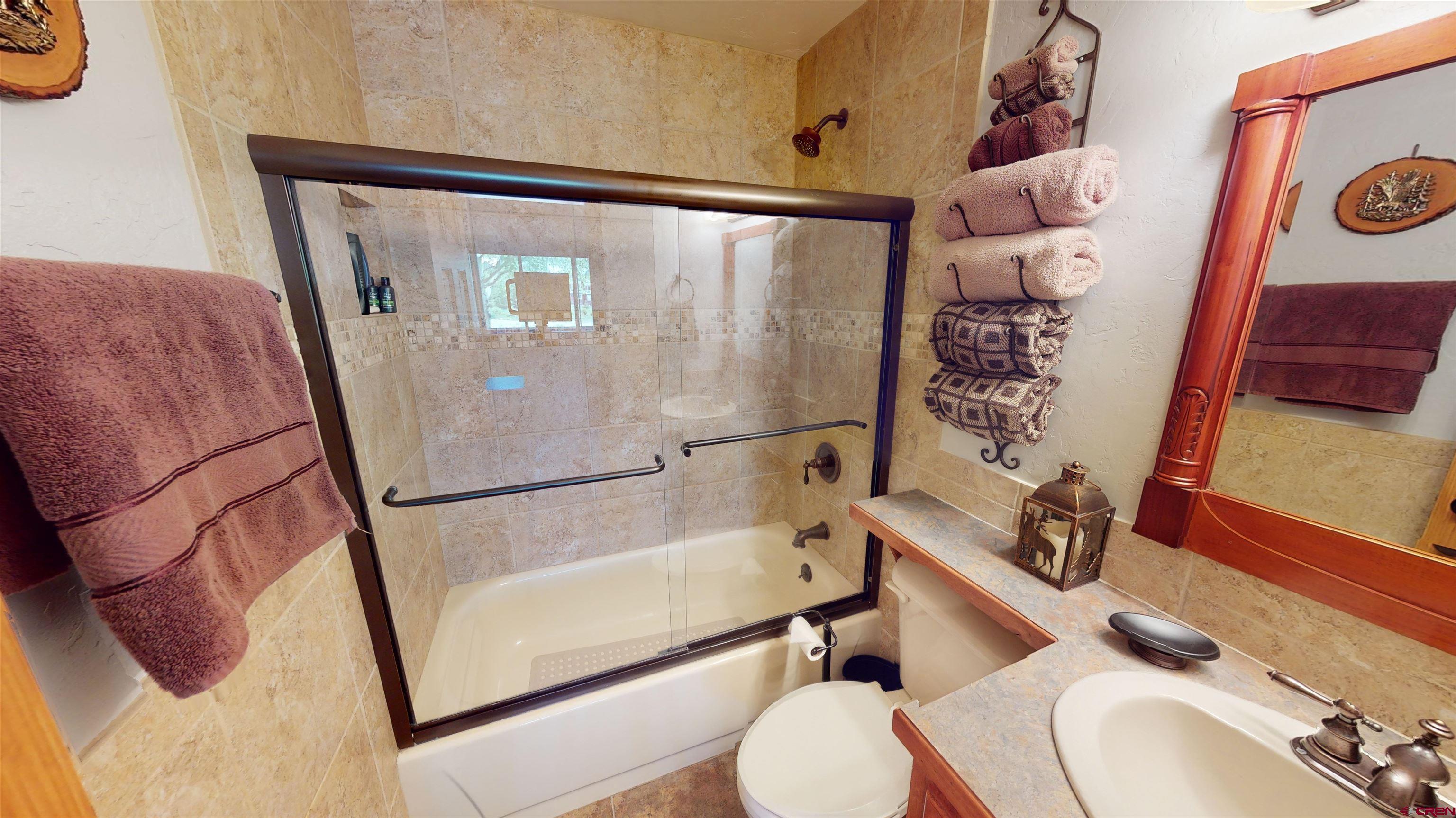 18 Crystal Road, Unit 3B Crested Butte, CO 81225 - Photo 17 of 20 a bathroom with a sink toilet and shower